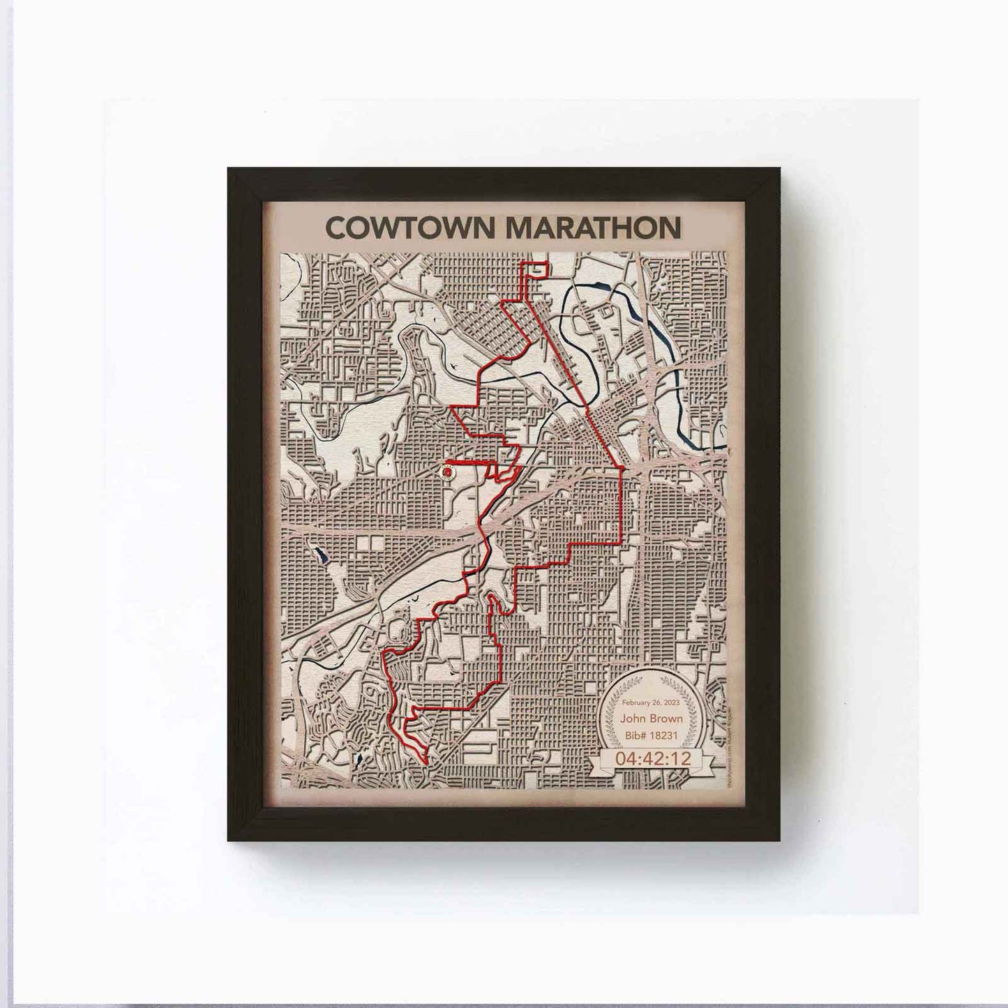 Framed map of the Cowtown Marathon with a red route highlighted.