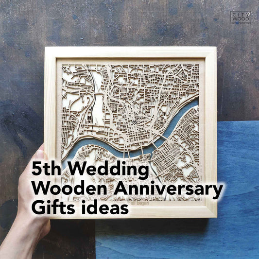 A wooden map of a city in a square frame with the text "5th Wedding Wooden Anniversary Gifts ideas" on the image.