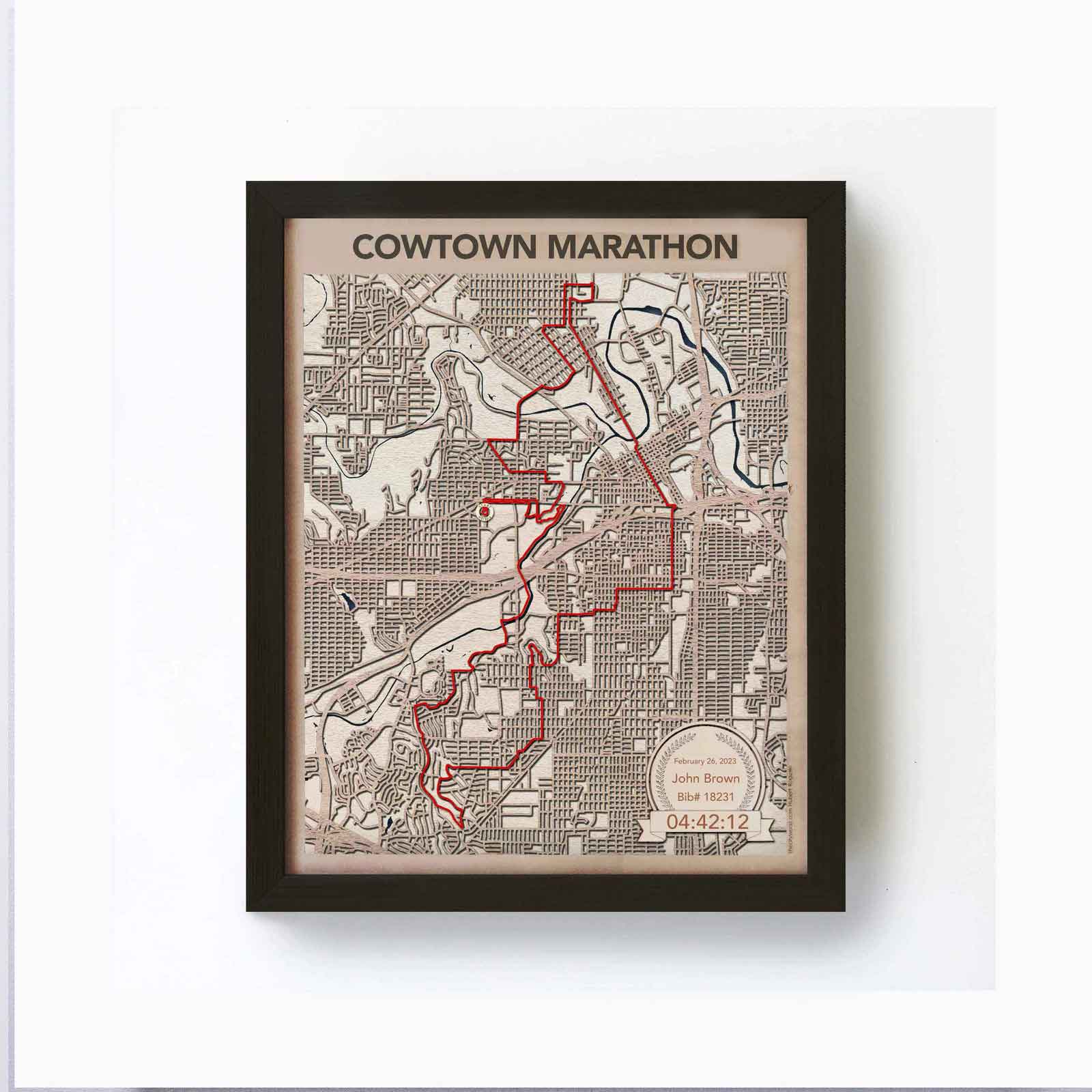 Framed map of the Cowtown Marathon with a red route highlighted.
